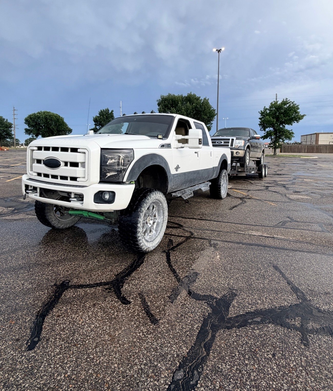 Pickup truck towing another truck